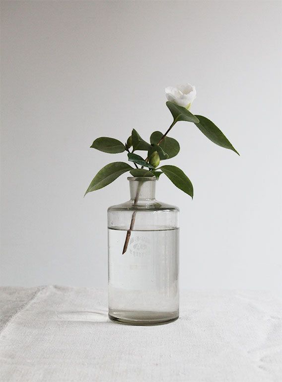 Vintage Litre Bottle on Table Image 2